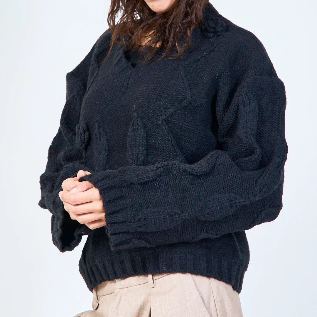 Textured cable knit sweater with floral detail wholesale
