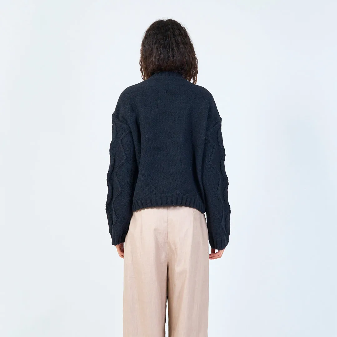 Textured cable knit sweater with floral detail wholesale